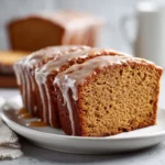 Close-up of pumpkin bread with maple glaze topped with chocolate chips.