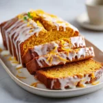 Moist Pumpkin Bread with Orange Glaze, topped with citrus drizzle and perfect for Pumpkin Desserts and Fall Bread Recipes.