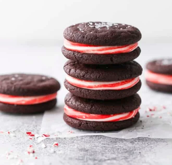 Delicious chocolate candy cane sandwich cookies with festive decorations
