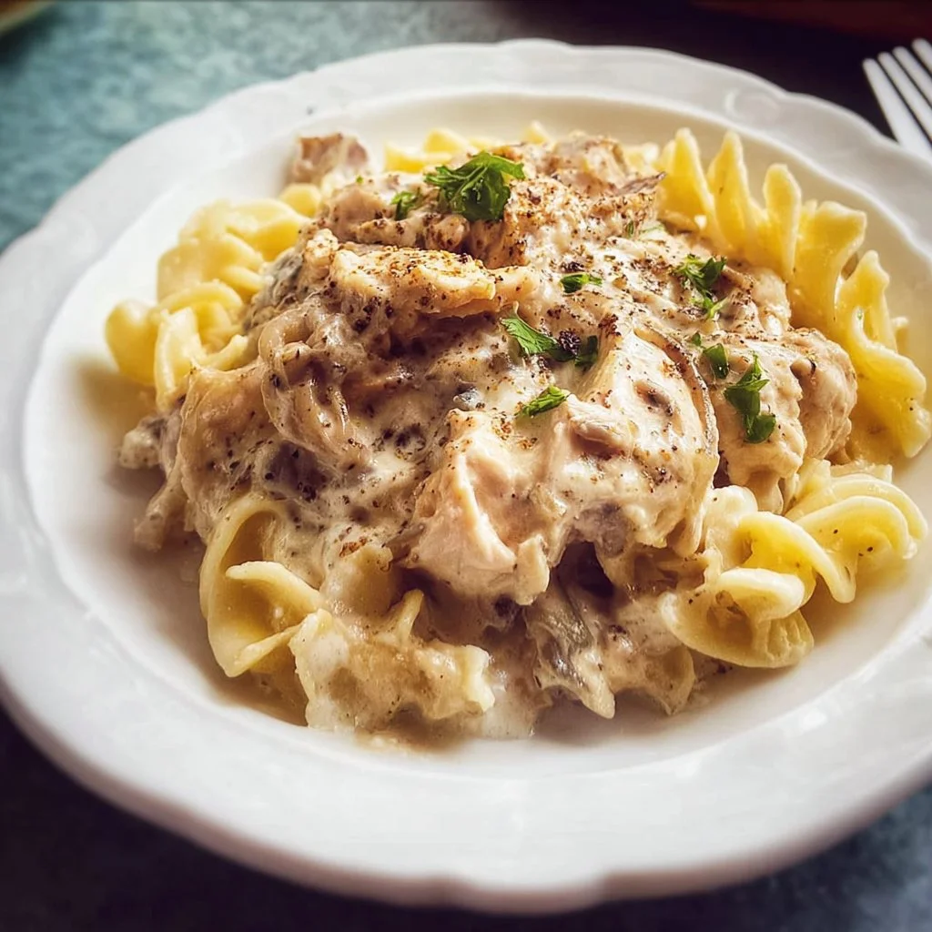 Delicious Slow Cooker Chicken Tetrazzini served in a bowl topped with parsley
