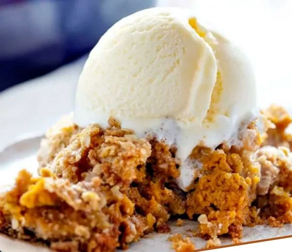 Delicious Pumpkin Crisp dessert with a golden crumbly topping and autumn spices.
