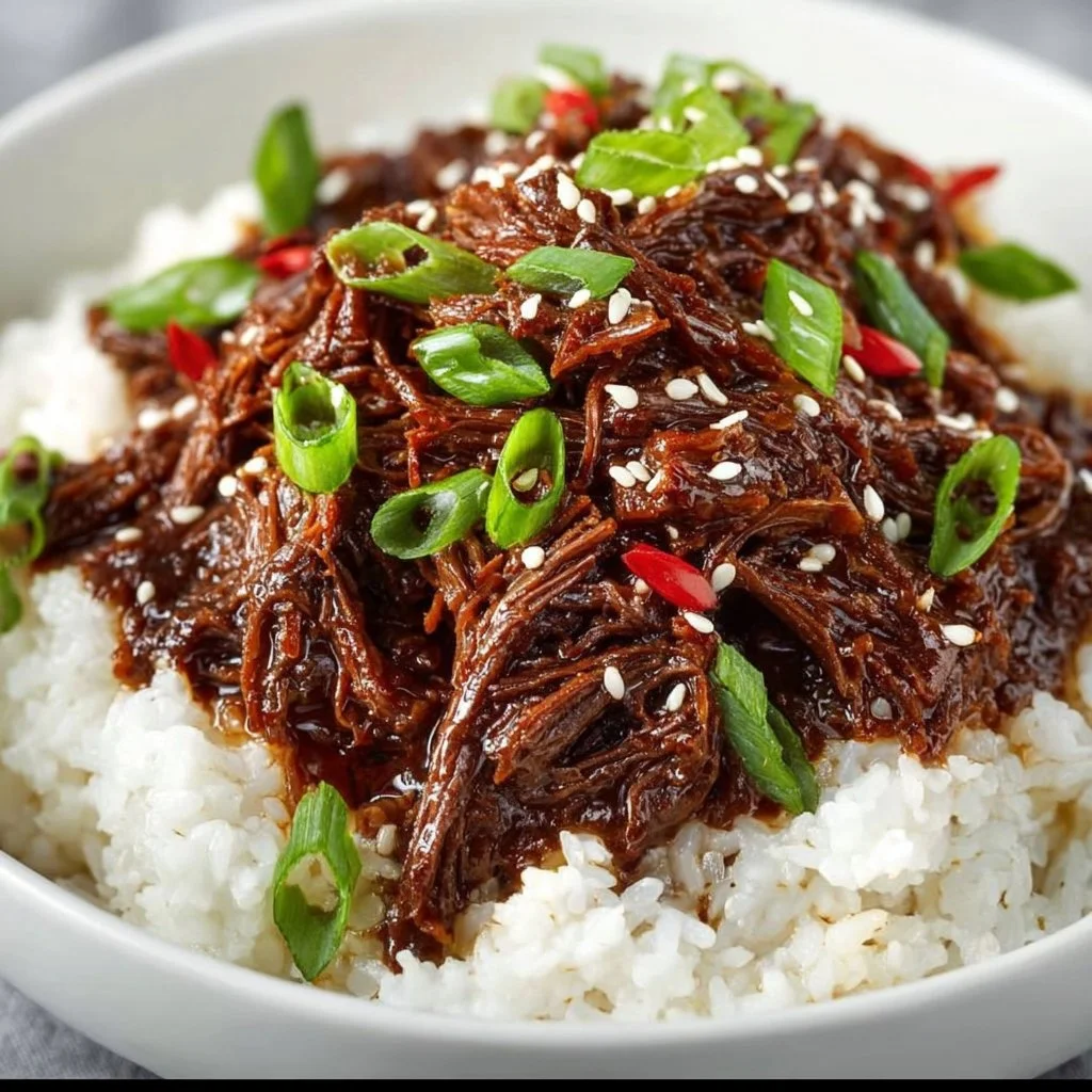 Delicious Slow Cooker Korean Beef served with rice and vegetables