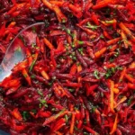Fresh beet and carrot salad with a drizzle of vinaigrette