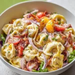 Delicious serving of Grinder Tortellini Salad with fresh ingredients.