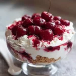 Delicious Cherry Cheesecake Fluff dessert topped with fresh cherries