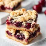 Delicious cherry crumb bars with a golden crumb topping and vibrant cherry filling