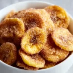 Cinnamon-sugar air fryer banana chips on a plate.