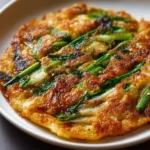 Crispy Korean Spring Onion Pancake garnished with green onions