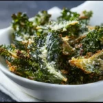 Garlic and Parmesan Kale Chips served in a bowl, a healthy crunchy snack.