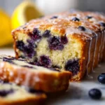 Deliciously baked Lemon Blueberry Loaf with fresh blueberries and a lemon glaze