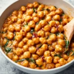 Plate of Marry Me Chickpeas, showcasing savory chickpeas and vibrant toppings.