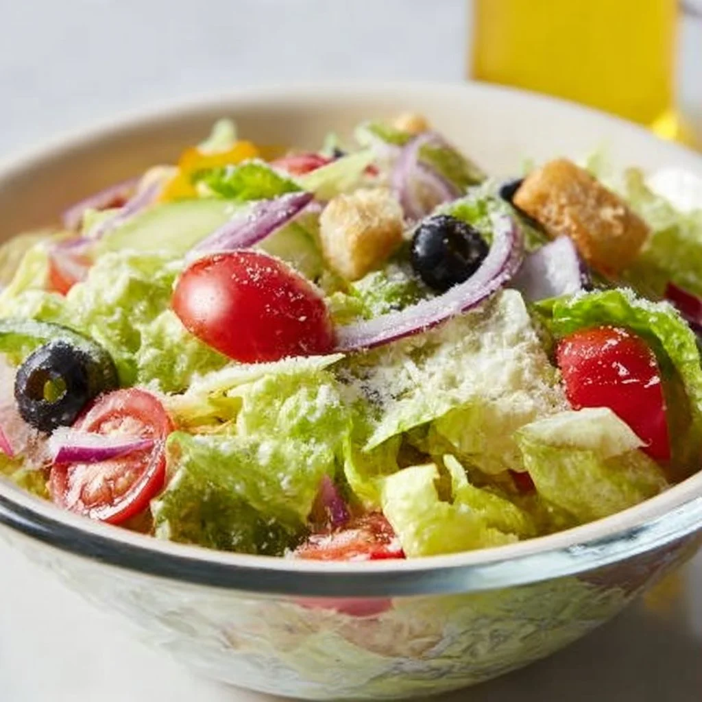 Delicious Olive Garden Salad served with fresh ingredients and Italian dressing
