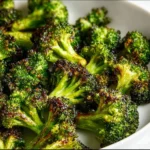 Delicious oven-roasted broccoli served on a plate