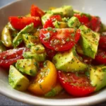 Quick Avocado and Tomato Salad 3 Fresh avocado tomato salad with herbs and a zesty dressing in a bowl