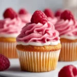 Delicious raspberry cupcakes with raspberry filling topped with frosting