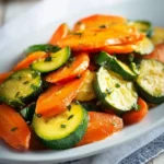 Plate of sautéed carrots and zucchini cooked to perfection