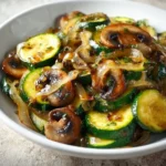 Delicious sautéed zucchini, mushrooms, and onions in a skillet