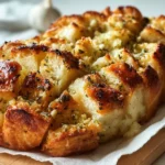 Freshly baked sourdough discard garlic pull apart bread with herbs