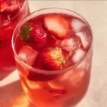 Strawberry Iced Tea 3 Refreshing glass of strawberry iced tea with fresh strawberries and ice