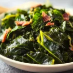 Delicious traditional collard greens served in a rustic bowl.