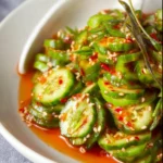 Asian Cucumber Salad 2 Bowl of delicious Asian cucumber salad with vibrant colors and fresh ingredients
