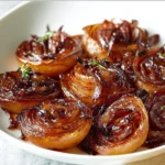 Caramelized Balsamic Onions 3 Caramelized balsamic onions in a skillet, freshly cooked and ready to serve.