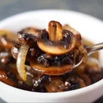 Caramelized Mushrooms and Onions 3 Delicious caramelized mushrooms and onions served in a skillet