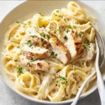 Delicious Chicken Alfredo with tender chicken and creamy sauce over pasta
