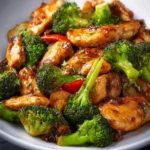 Chicken Stir-Fry 3 Delicious Chicken Stir-Fry with colorful vegetables in a skillet.