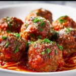 Delicious Classic Italian Meatballs served with marinara sauce and spaghetti.