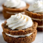 Delicious ginger cream pies topped with whipped cream and ginger garnish