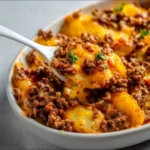 Delicious Hobo Casserole with ground beef and vegetables baked in a dish