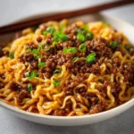 Mongolian Ground Beef Noodles 3 Mongolian ground beef noodles served in a bowl with fresh vegetables