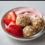 No-Bake Strawberry Cheesecake Protein Balls 3 No-Bake Strawberry Cheesecake Protein Balls ready to enjoy as a healthy snack