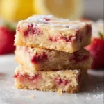 Strawberry Lemon Blondies 2 Delicious strawberry lemon blondies on a plate with fresh strawberries