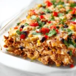 Delicious Chicken Burrito Casserole ready to serve with toppings