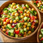 Delicious chickpea ceviche served in a bowl with fresh herbs and vegetables.