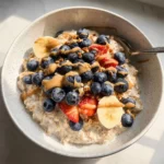 Bowl of classic overnight oats topped with fresh fruits and nuts