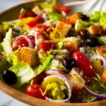 Copycat Olive Garden Salad 4 Delicious homemade copycat Olive Garden Salad with fresh vegetables and dressing