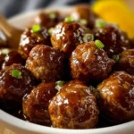 Delicious Crockpot Mississippi Meatballs served with sauce on a platter.