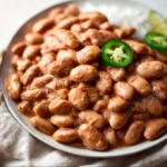 Delicious easy pinto beans recipe served in a bowl with spices.