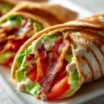 Healthy BLT wraps topped with secret sauce served on a plate