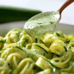 Delicious homemade zucchini sauce served in a bowl with fresh herbs