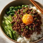 Delicious Korean Ground Beef Bowl garnished with vegetables and rice