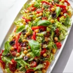 Pizza Salad 4 A vibrant Pizza Salad topped with fresh vegetables and delicious cheese.