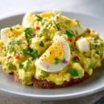 Simple Mediterranean avocado egg salad with fresh ingredients and spices