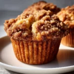 Freshly baked Apple Cinnamon Streusel Muffins on a wooden table