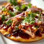 Delicious BBQ Chicken Flatbread topped with fresh ingredients and BBQ sauce