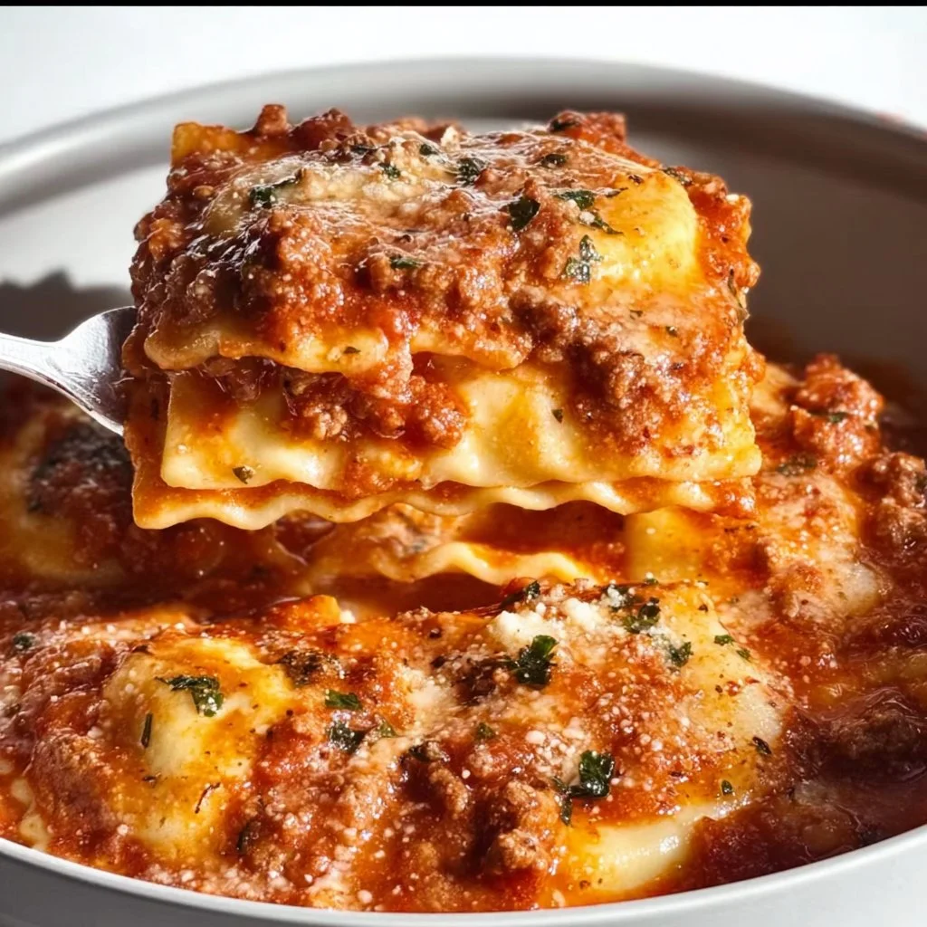 A delicious serving of Crockpot Ravioli Lasagna with layers of cheese and pasta.