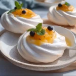 Mini Meringues with Citrus Curd 3 Delicious mini meringues served with vibrant citrus curd